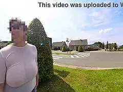 busty milf braless in transparent top strolls street