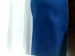 Curvy mature woman films herself in shopping fitting room