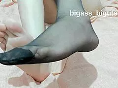 Amateur woman shows feet wearing socks for fetish play at home