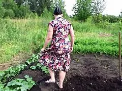 mature housewife masturbates with a cucumber in the garden outdoors