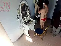 voyeur camera shows nude lady undressing for hair cut at barber