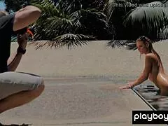 Stunning redhead milf gia marie poses naked in the pool outdoor