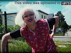 German granny in cosplay stands outdoors in costume