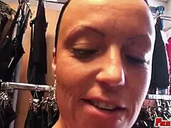 mature beauty indulges in passionate fucking within a sex shop, her shaved body glistening as she reaches orgasm through masturbation and handjob.
