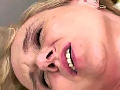 Mature woman guides young boy in intimate encounter