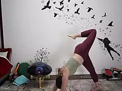 In a private yoga session, the instructor guides through explicit moves, focusing on tight cameltoe and bare feet.